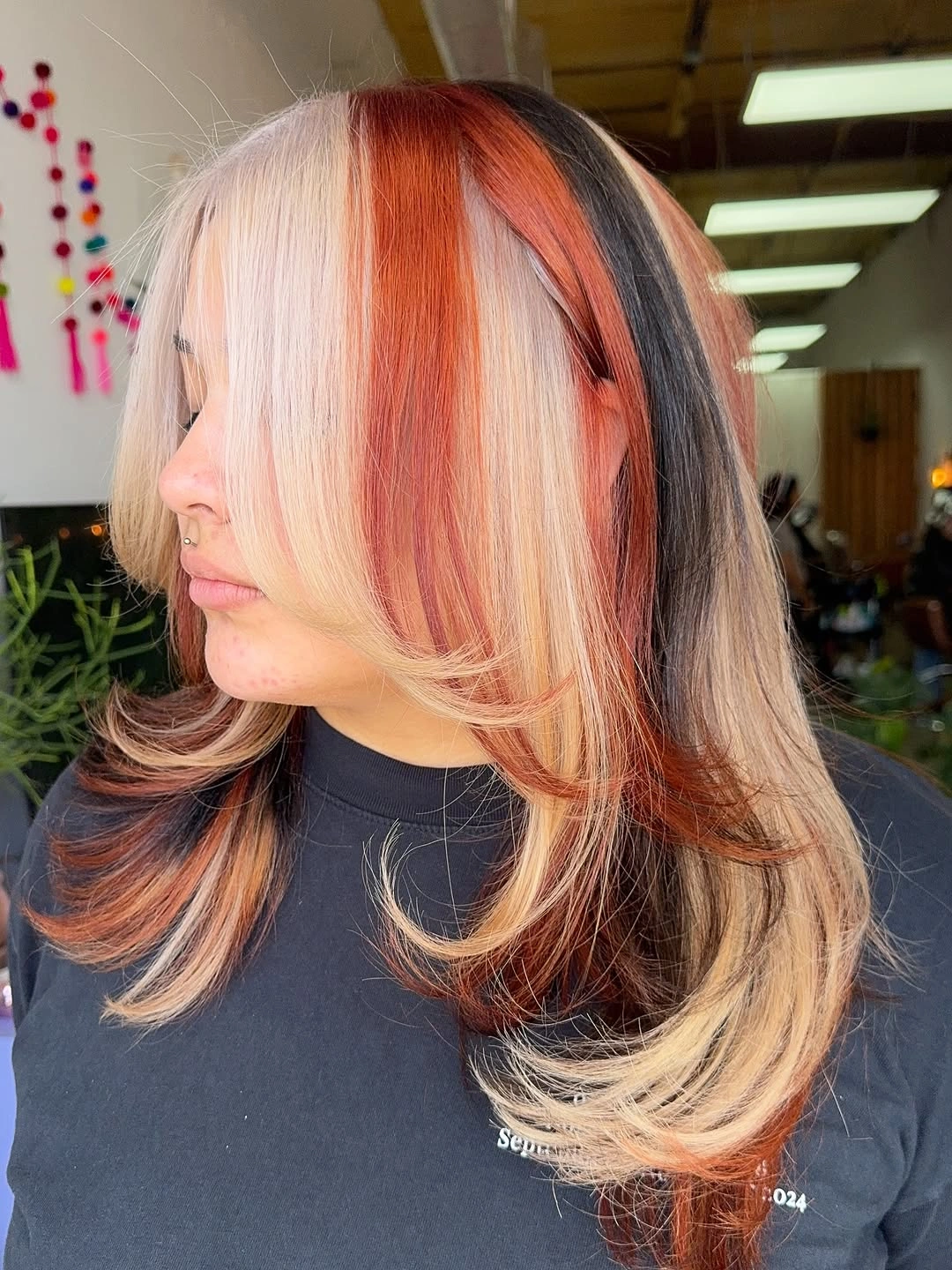 fall hairstyles 2026 Statement Color Blocking With Layered Curtain Bangs