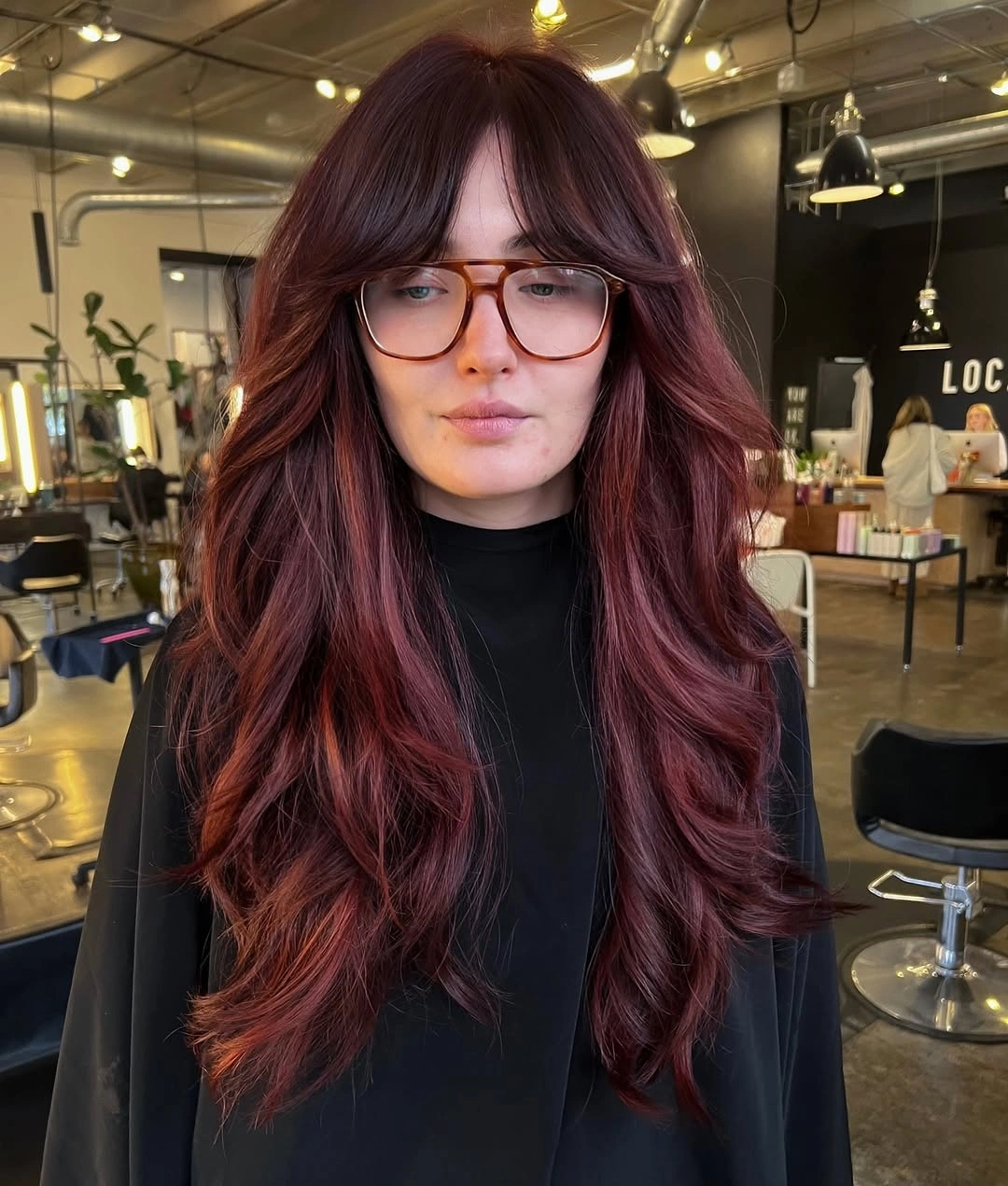 fall hairstyles 2026 Voluminous Bordeaux Layers With Curtain Bangs