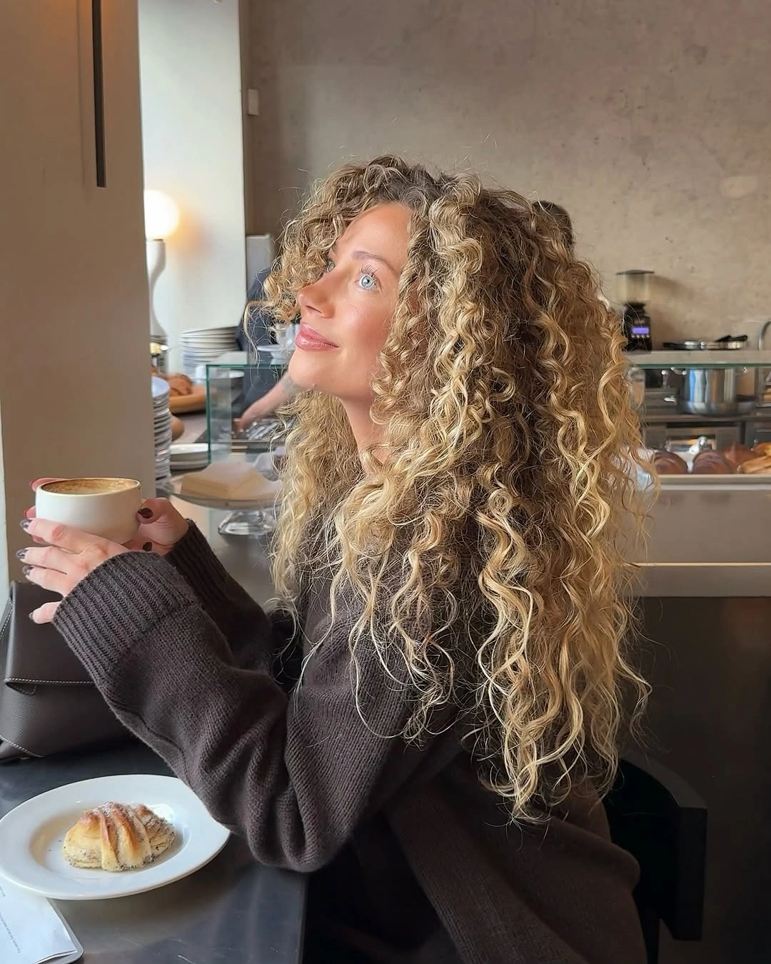 fall hairstyles 2026 Soft Blonde Curls Full Of Autumn Movement
