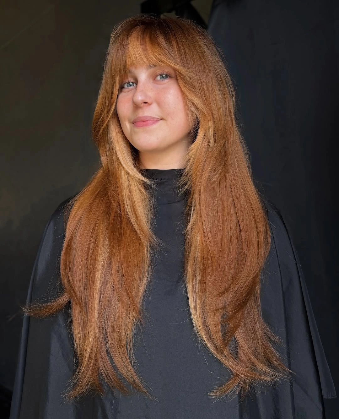 fall hairstyles for long hair 2026 Long Ginger Layers with Wispy Curtain Bangs