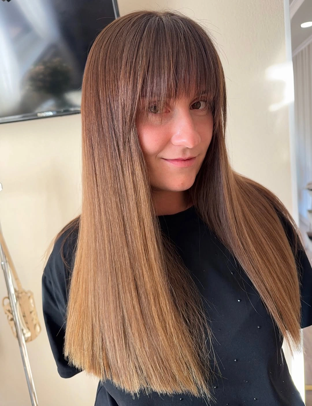 Fall hairstyles for office 2026 Long Glass Hair with Soft Full Fringe