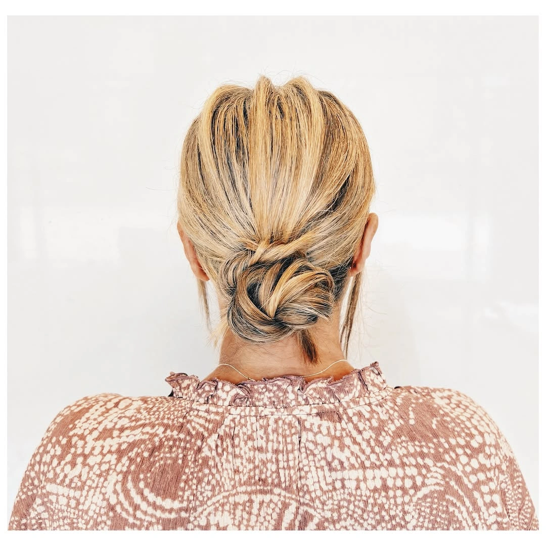 Fall hairstyles for office 2026 Relaxed Twisted Low Bun for Busy Fall Mornings