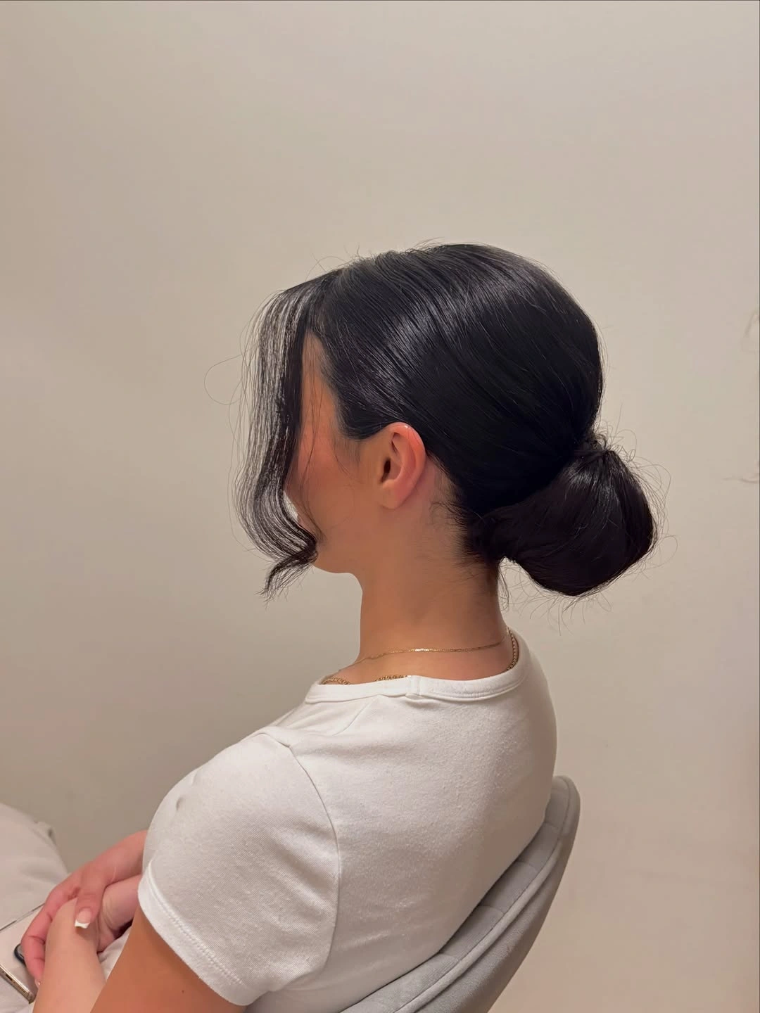 Fall hairstyles for office 2026 Minimalist Low Bun with Soft Face-Framing Pieces