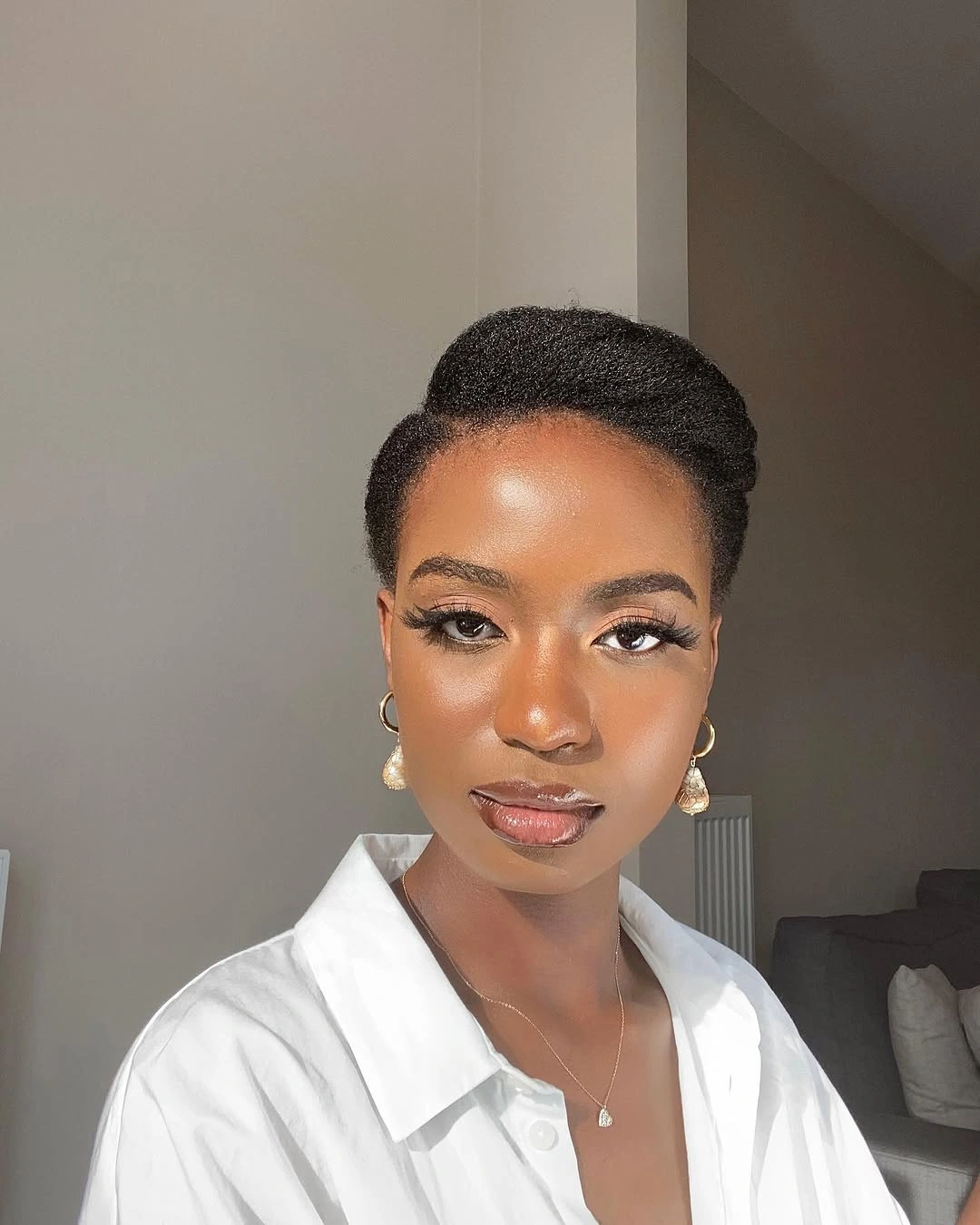 Fall hairstyles for office 2026 Elegant Natural Updo for a Modern Professional Look