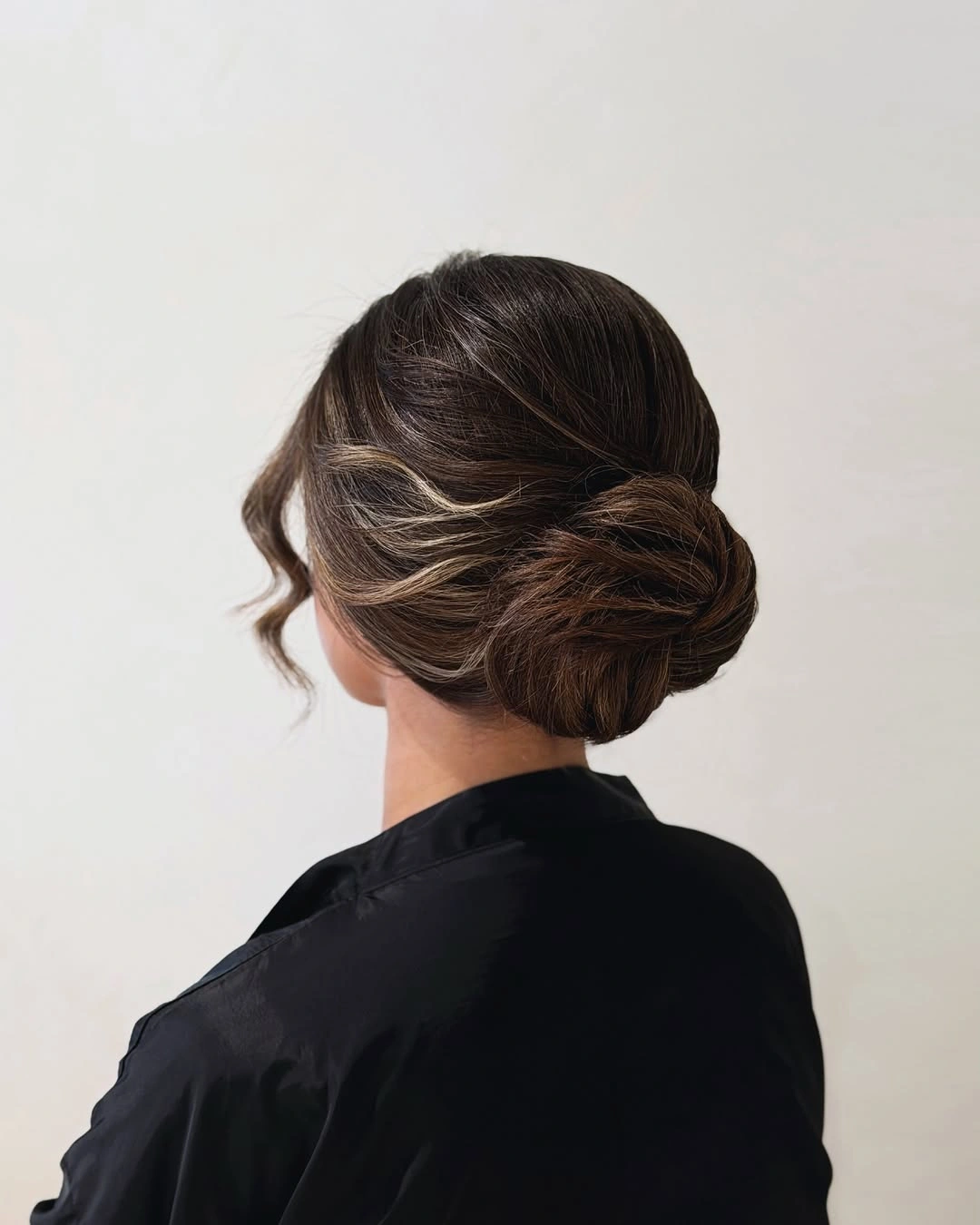 Fall hairstyles for office 2026 Soft Twisted Chignon with Face-Framing Pieces