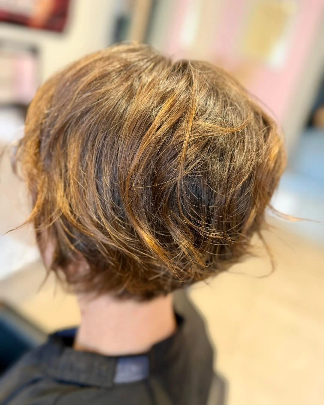 Fall hairstyles for short hair 2026 Textured Layered Bob With Warm Caramel Highlights