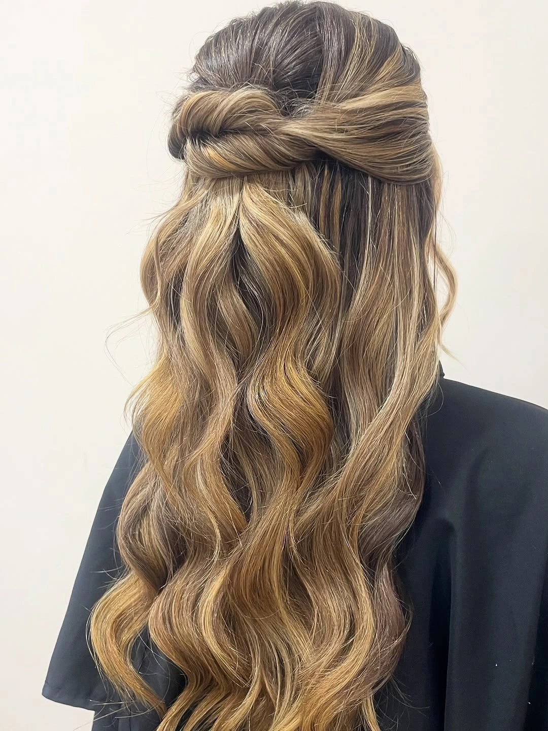 Fall hairstyles for wedding guests 2026 Romantic Twisted Half-Up Waves for an Elegant Autumn Ceremony