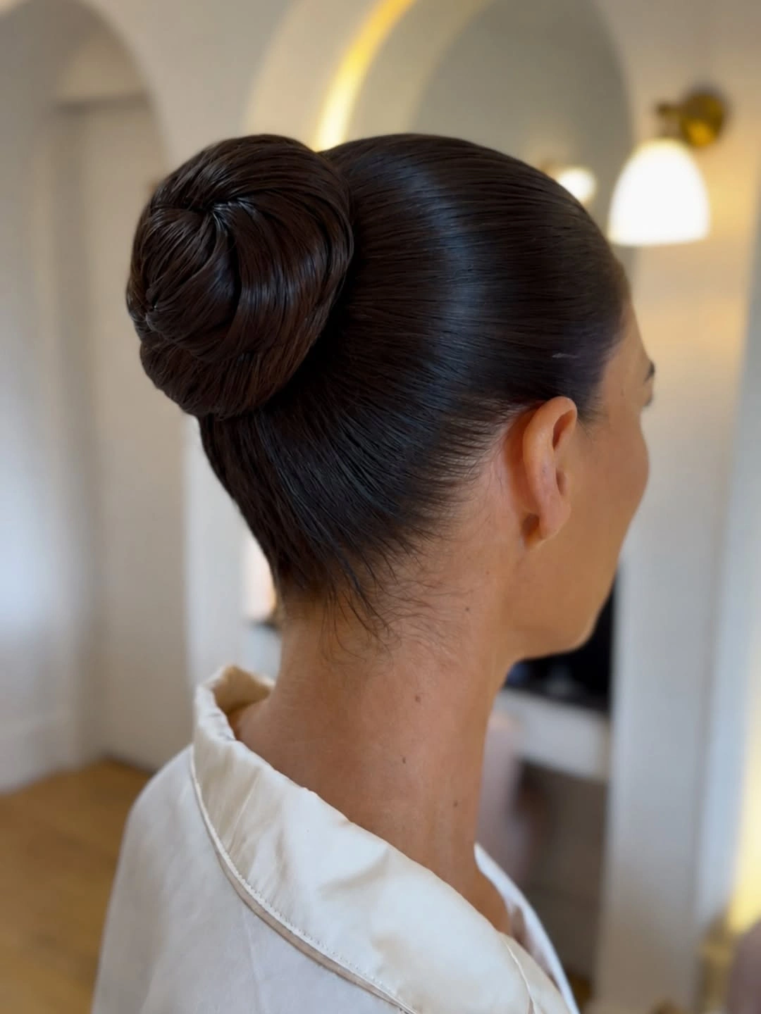Fall hairstyles for wedding guests 2026 Minimalist Sleek Ballet Bun with Modern Elegance
