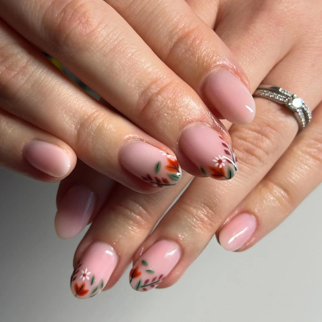 Fall manicure 2026 Blush Nails With Tiny Autumn Leaf Tips