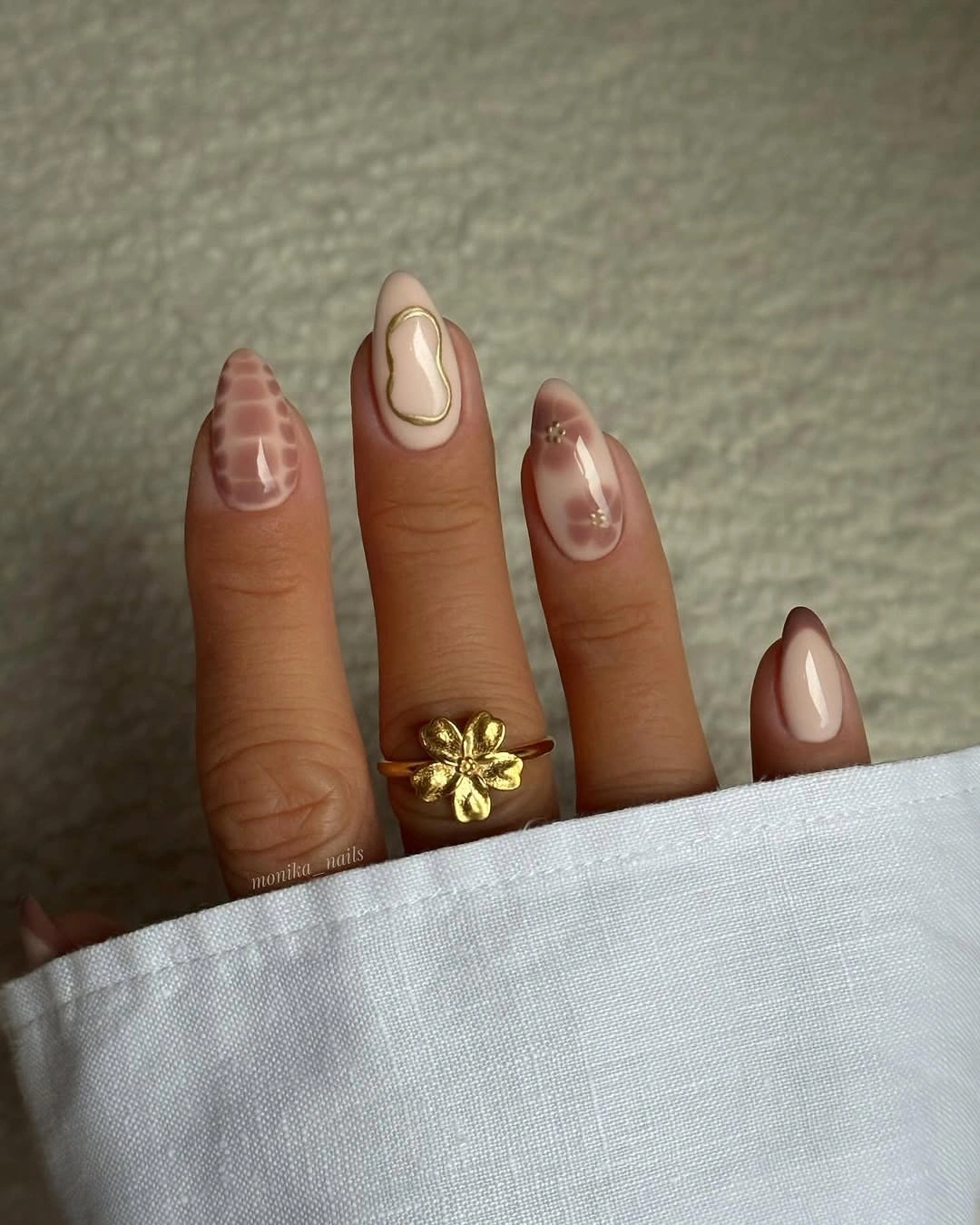 Fall manicure 2026 Neutral Swirl Manicure With Brown Accent