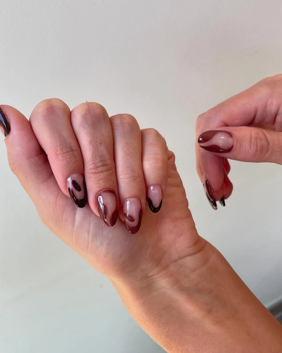 Fall manicure 2026 Burgundy Short Nails With Abstract Black Curves