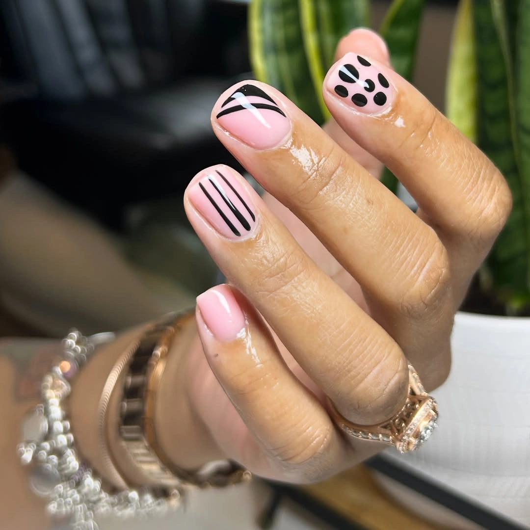 Fall manicure 2026 Pink Graphic Manicure With Black Line Accents
