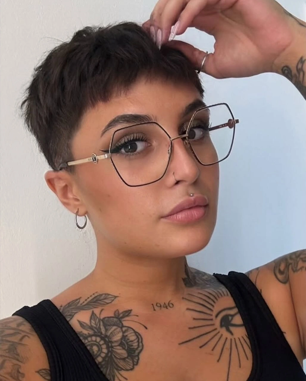 fall pixie haircut ideas 2026 Textured Brunette Pixie With Soft Baby Bangs