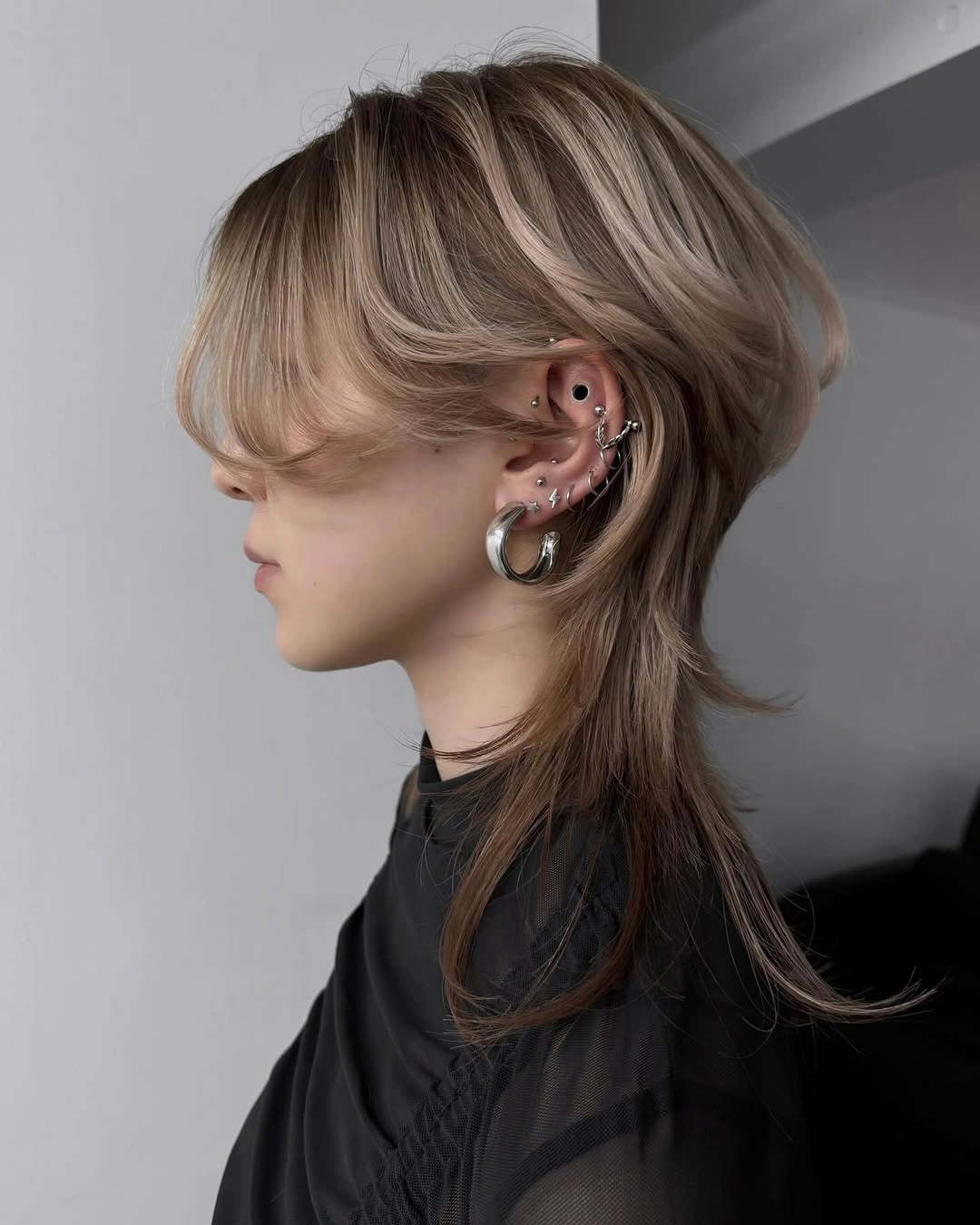 fall medium haircuts 2026 Modern Wolf Cut With Long Tail Layers