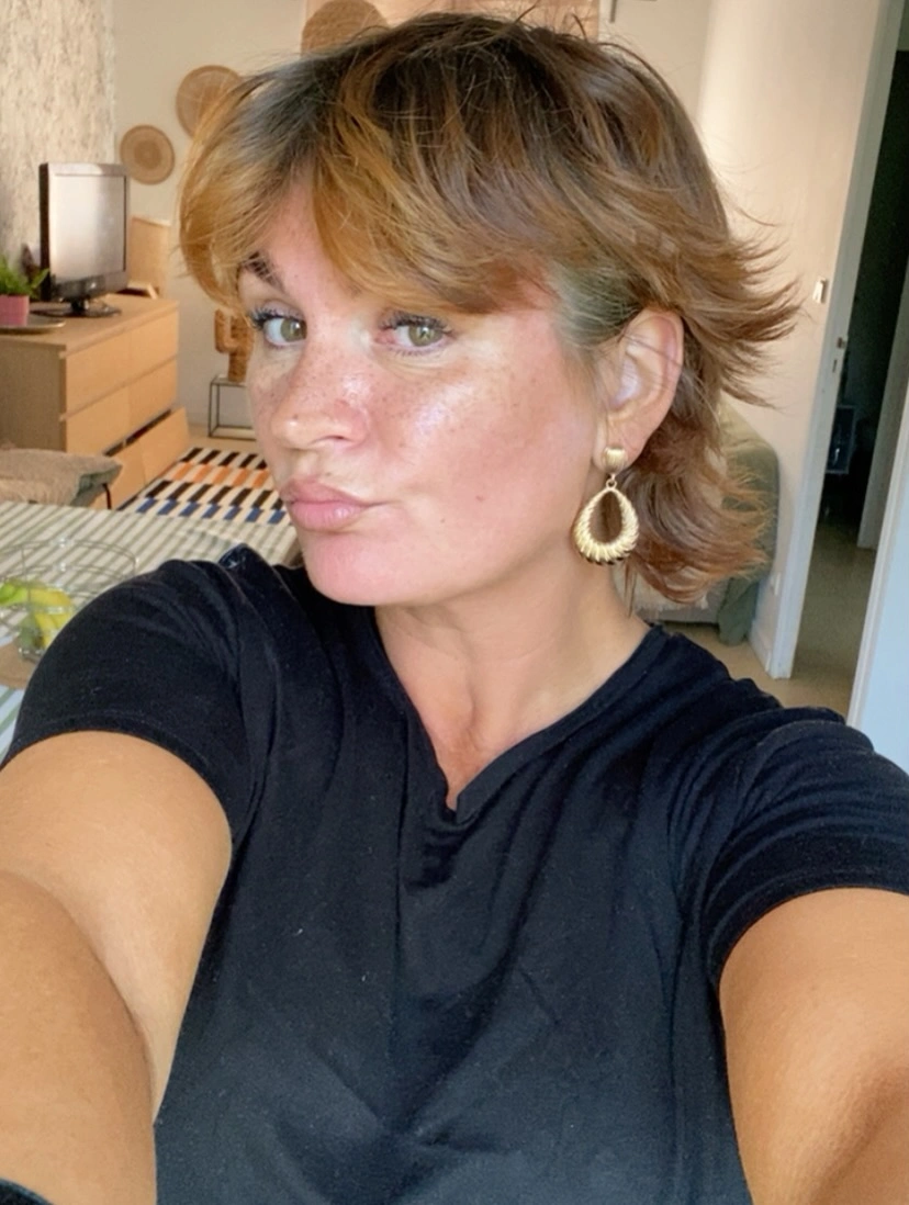 fall short haircuts 2026 Feathered Butterfly Pixie With Soft Flicked Layers