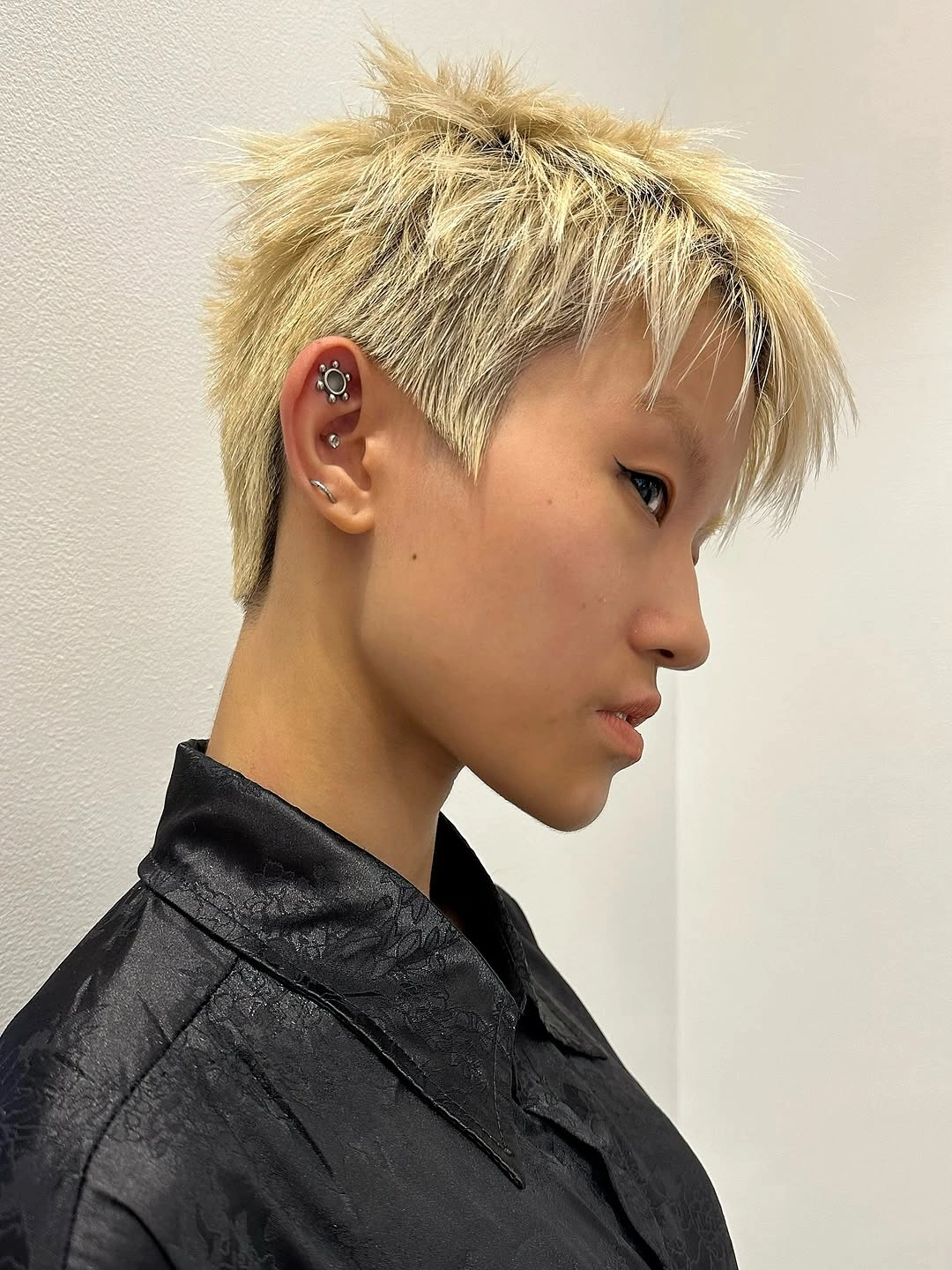 fall short haircuts 2026 Textured Platinum Pixie With Modern Rock-Star Energy