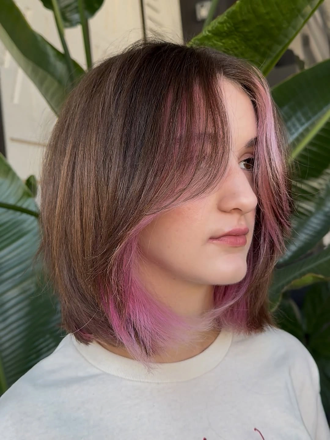 fall medium haircuts 2026 Soft Pink Peekaboo Bob With Curtain Layers