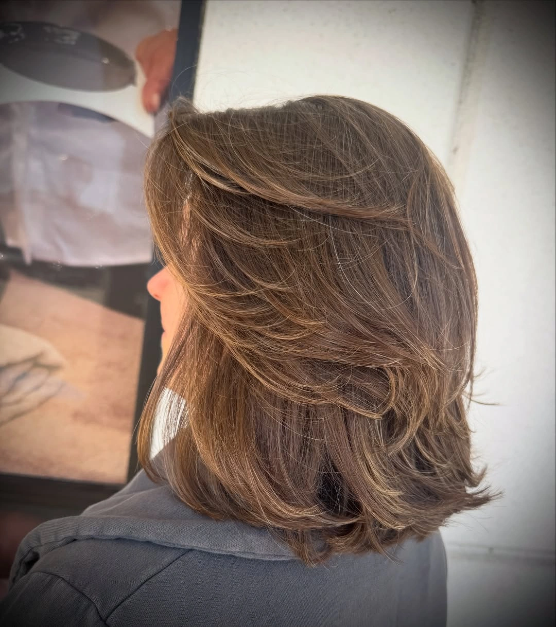 fall medium haircuts 2026 Luxury Feathered Layers With Soft Caramel Dimension
