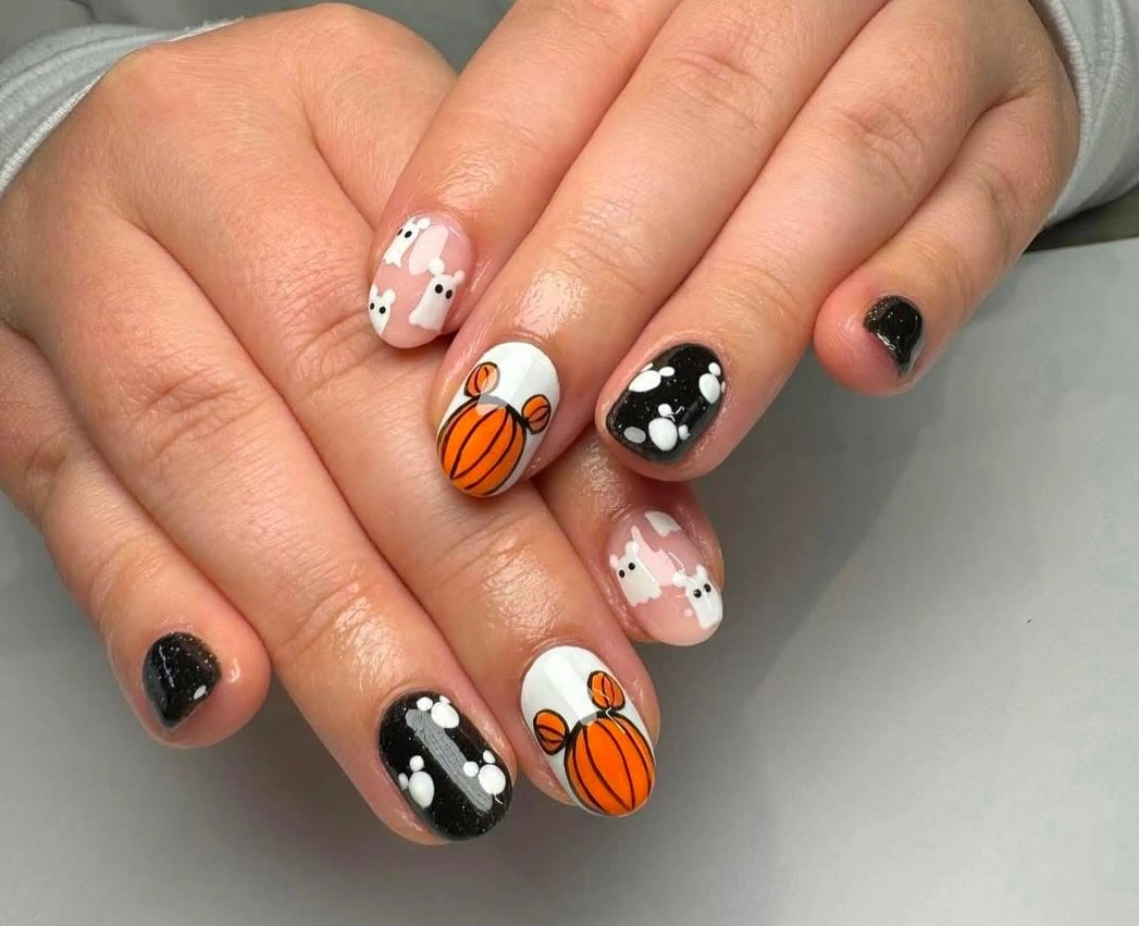 Fall short nails 2026 Black Pumpkin Nails With White Floral Accents