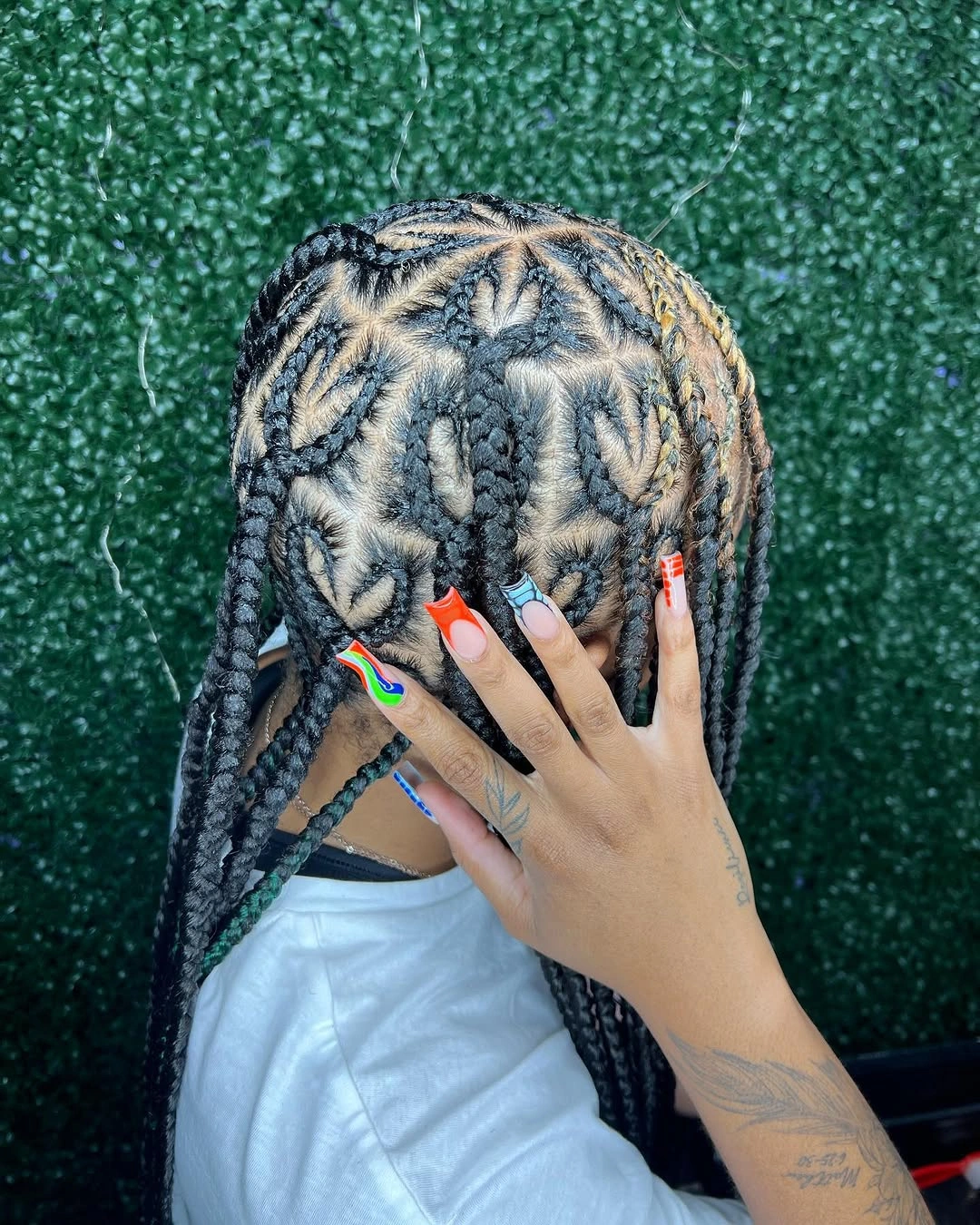feed in braid hairstyles Intricate Heart-Inspired Feed-In Braids with Bold Pattern Work