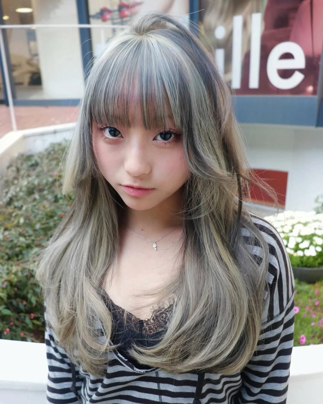 Hair Lowlights: Color Ideas and Inspiration Silver Mushroom Blonde With Wispy Bangs