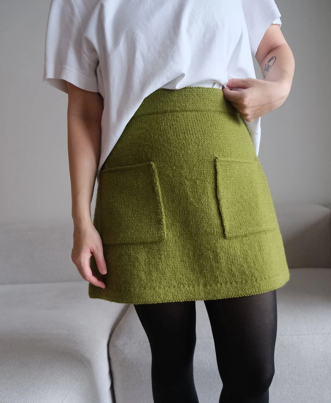 knit skirt outfits fall 2026 A Fresh Green Mini That Brightens Cloudy Fall Days