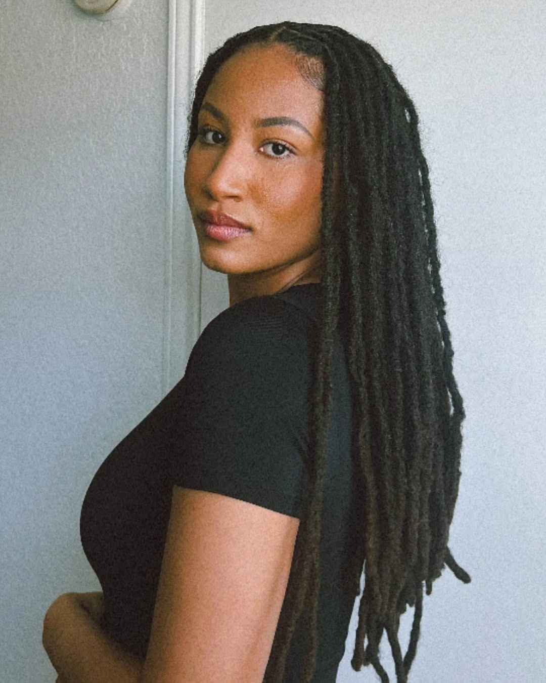 locs hairstyles for black women Classic Waist-Length Traditional Locs with a Center Part