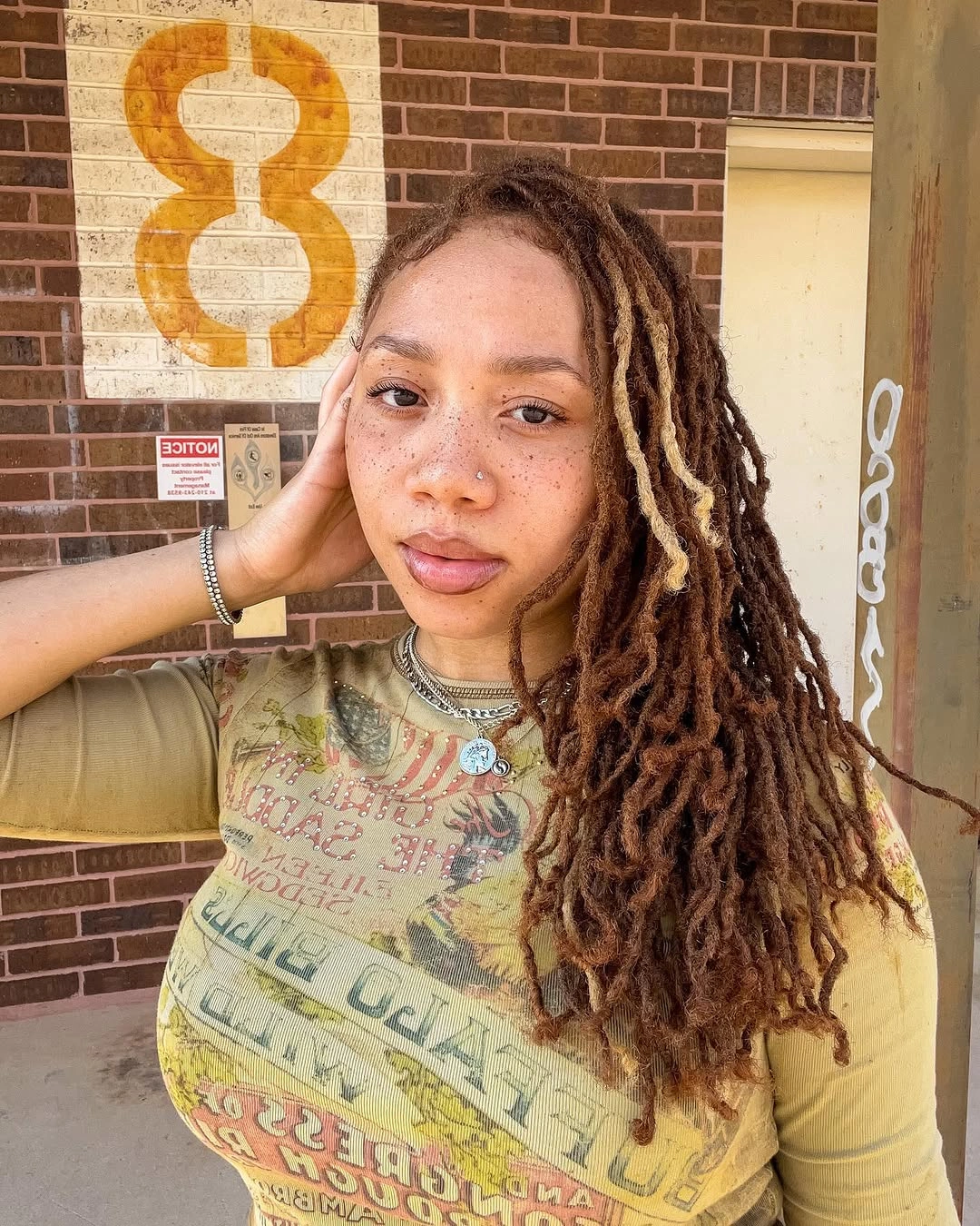 locs hairstyles for black women Warm Brown Side-Swept Locs with Sun-Kissed Highlights