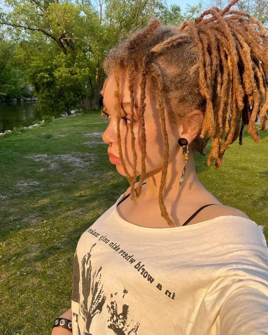 locs hairstyles for black women Textured Blonde Loc Bun with Face-Framing Pieces