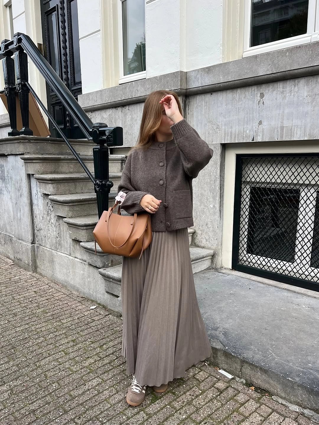 modest fall outfits 2026 Monochrome Knitwear with a Flowing Pleated Skirt
