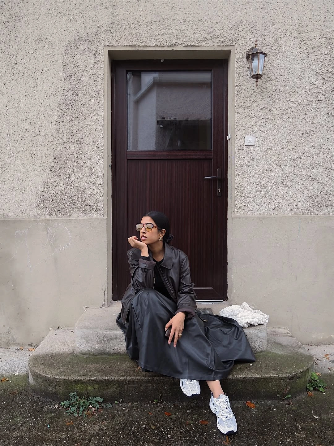 modest fall outfits 2026 Dark Leather Layers with Sporty Sneakers