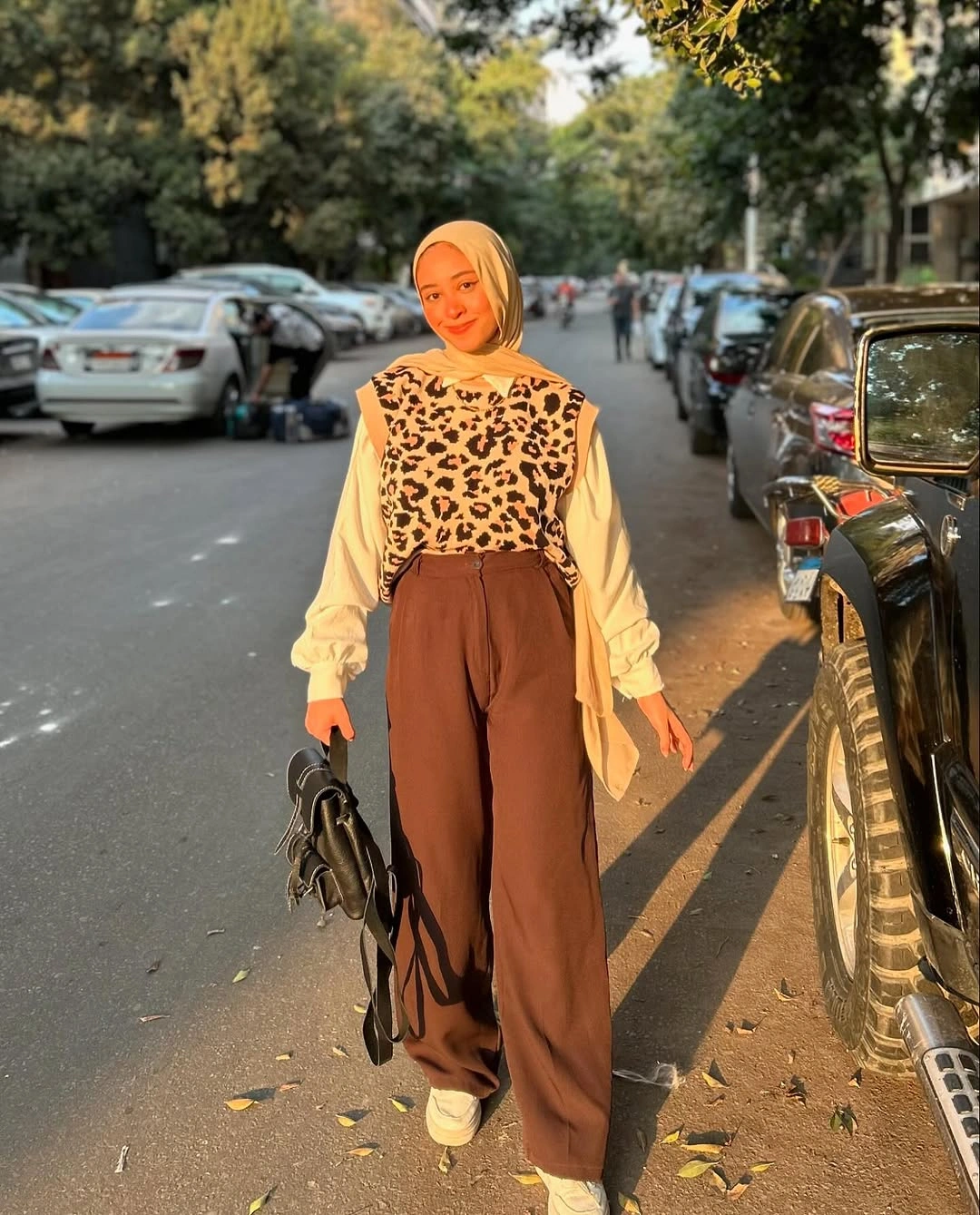 modest fall outfits 2026 Leopard Knit Vest with Wide-Leg Trousers for a Modern Modest Look