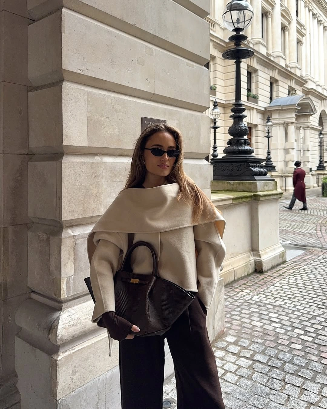 September fashion trends 2026 Cream Cape Knit With Dark Wide Trousers