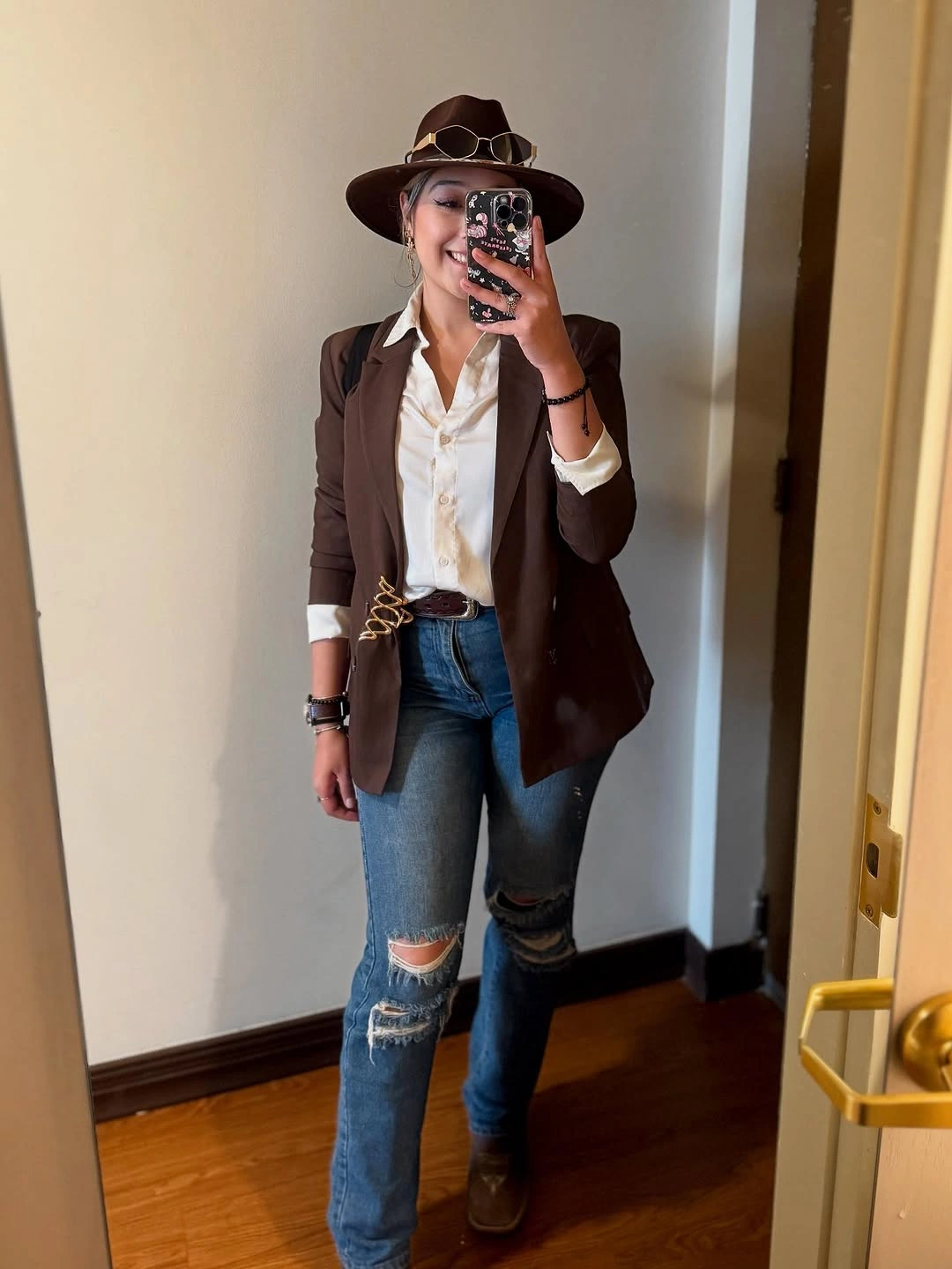 September fashion trends 2026 Burgundy Vest With Ripped Denim And Hat