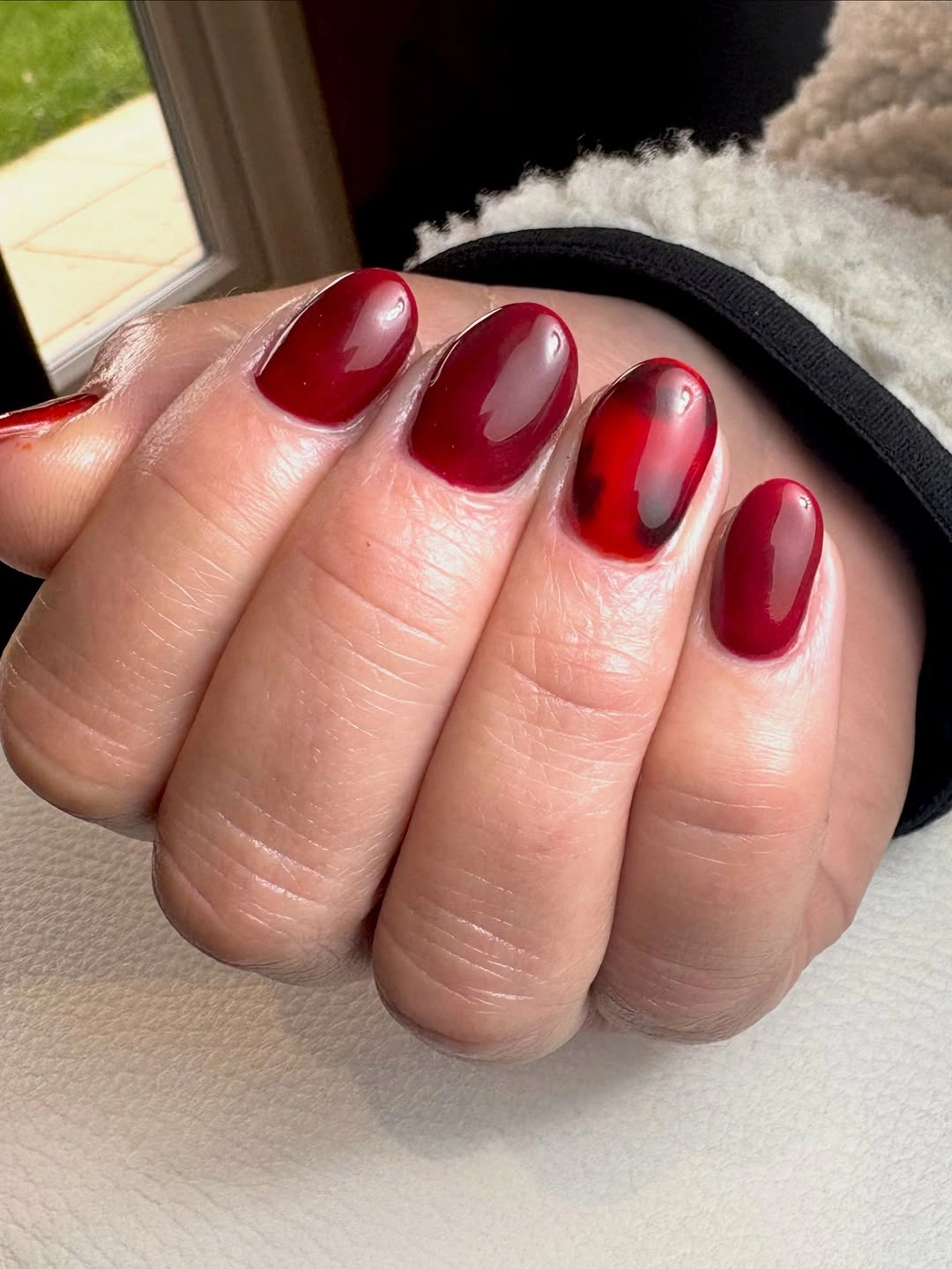 September nail art ideas 2026 Glossy Red Almond Nails With Black Shadow Edges