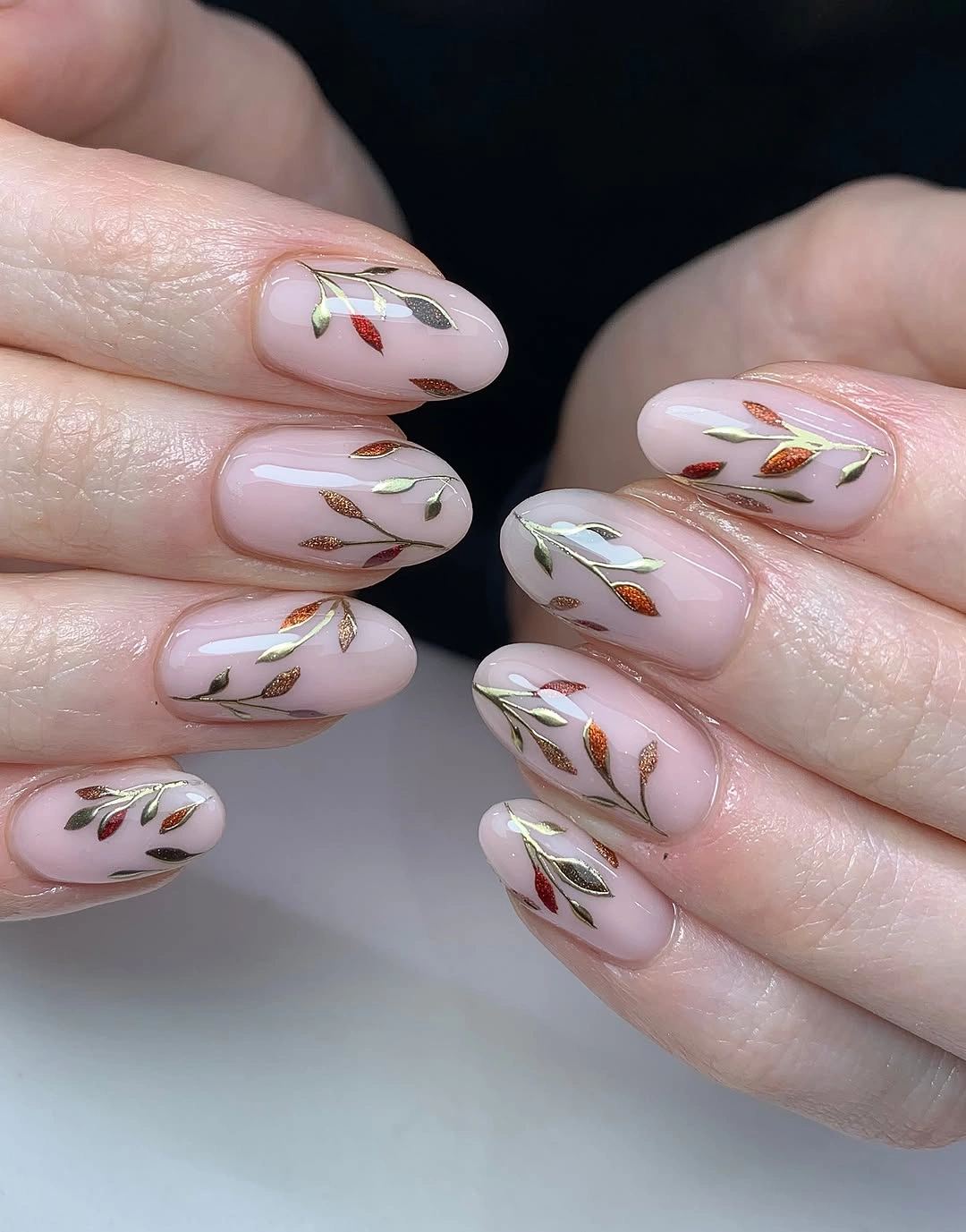 September nail art ideas 2026 Delicate Leaf Stems on Pale Pink Almonds