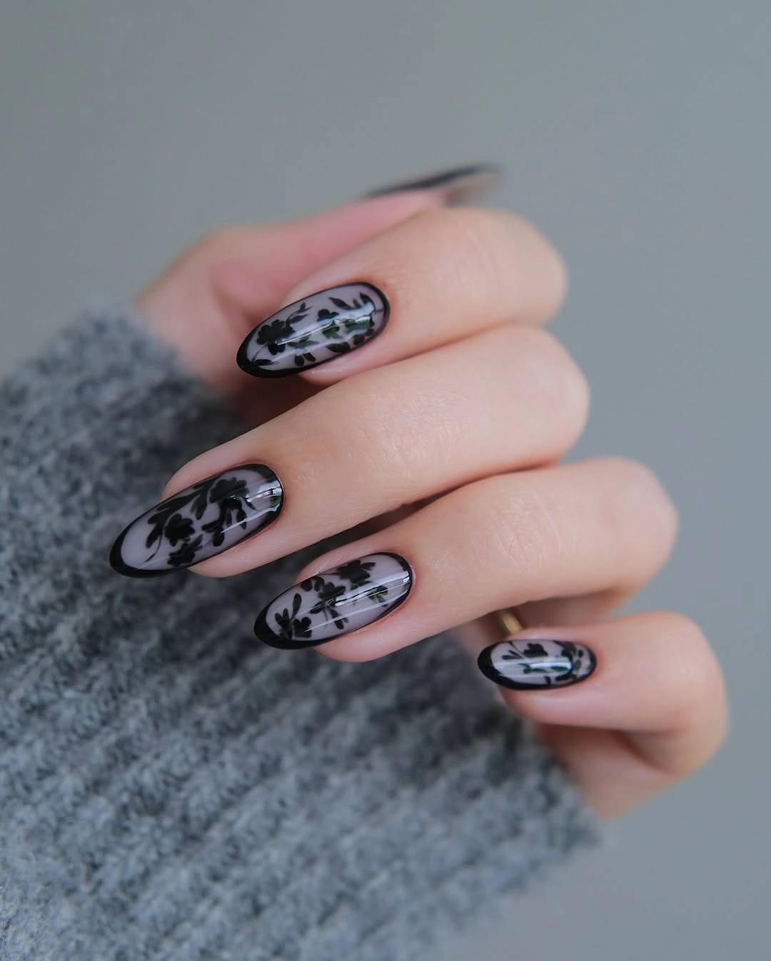 September nail art ideas 2026 Black Floral Lace on Sheer Almond Nails
