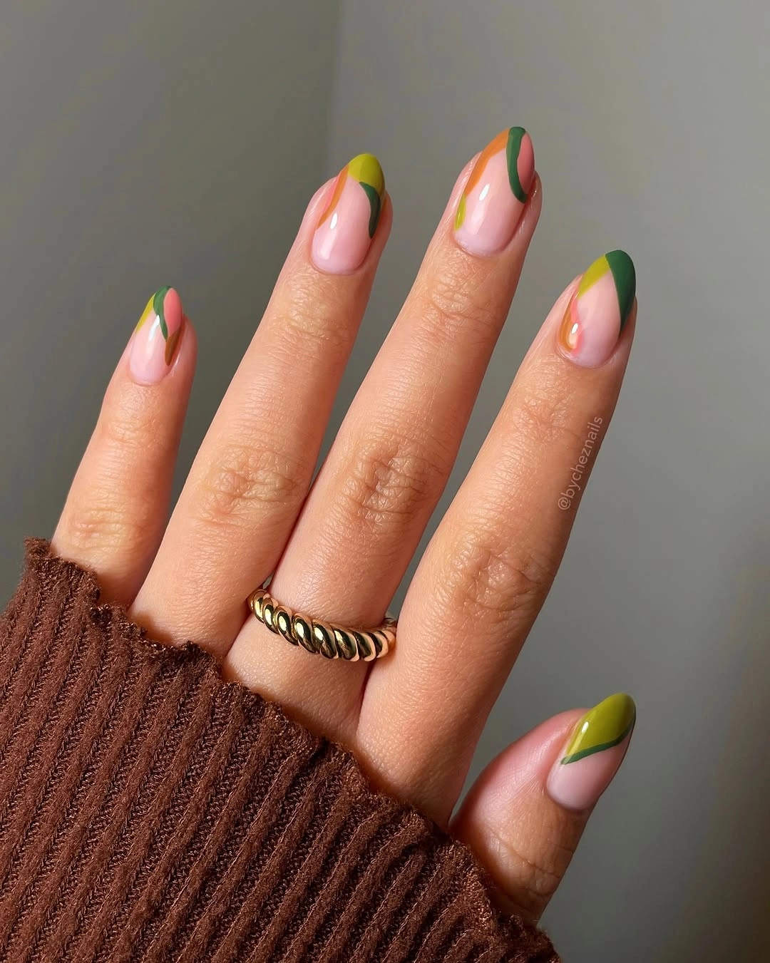 September nail art ideas 2026 Olive and Rust Curves on Pink Almond Nails