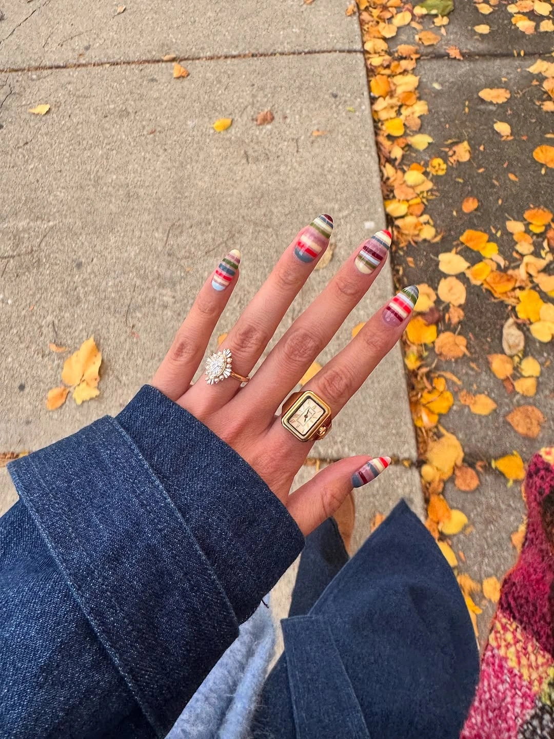September nail art ideas 2026 Striped Short Nails Against Fallen Leaves