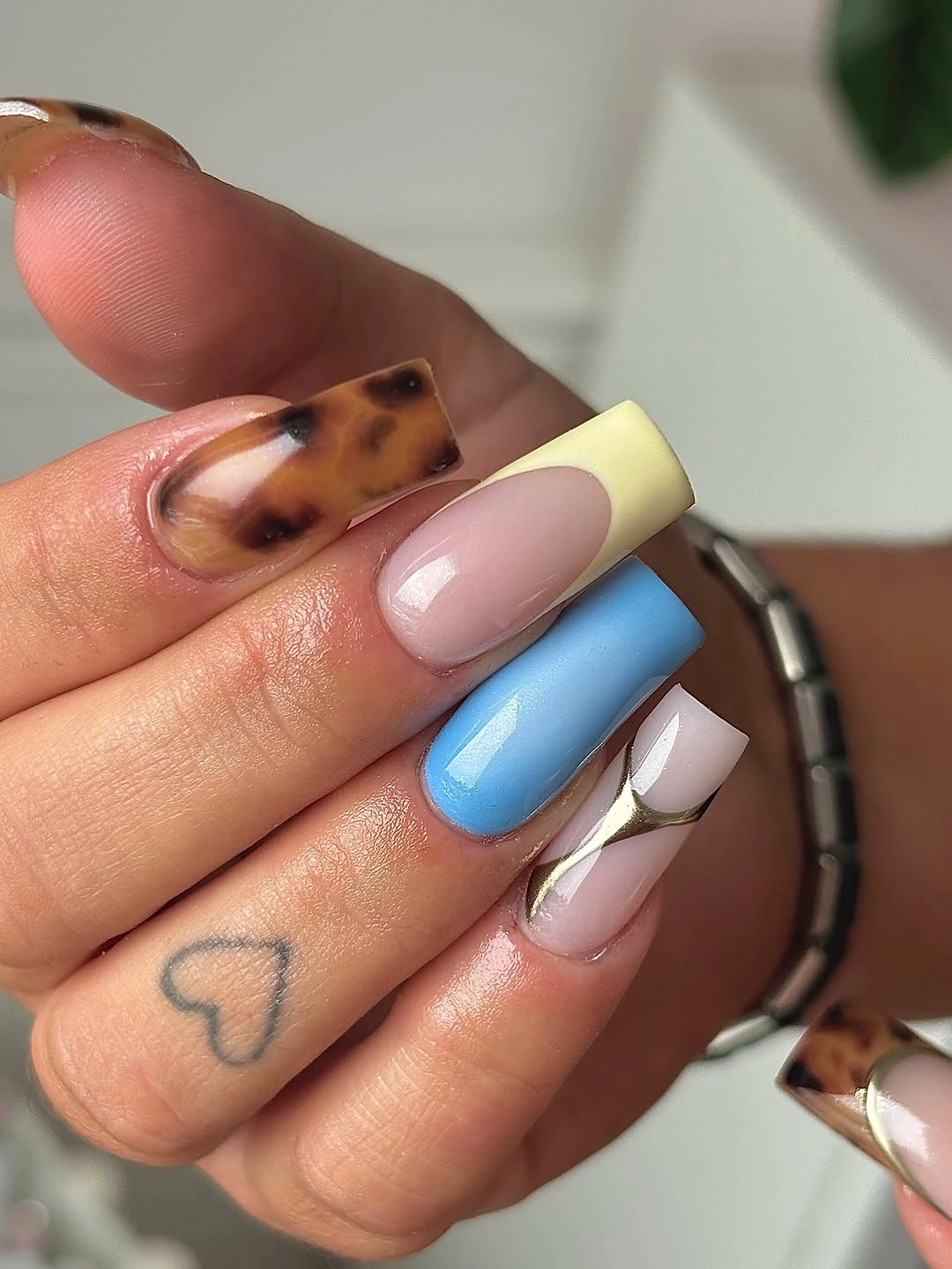 September nail art ideas 2026 Tortoise and Pastel Blocks on Square Tips