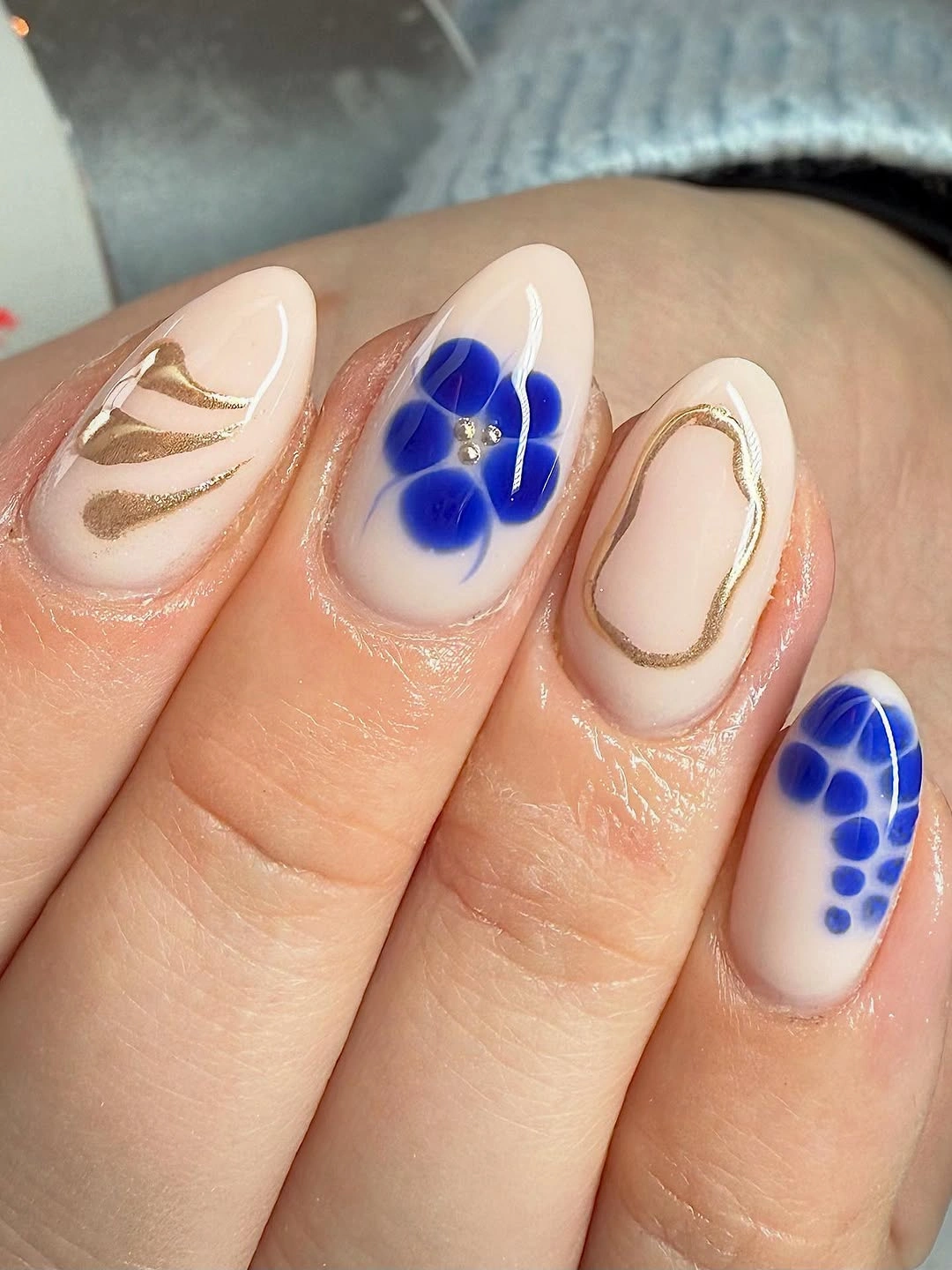 September nail art ideas 2026 Blue Dot Flowers With Gold Line Art