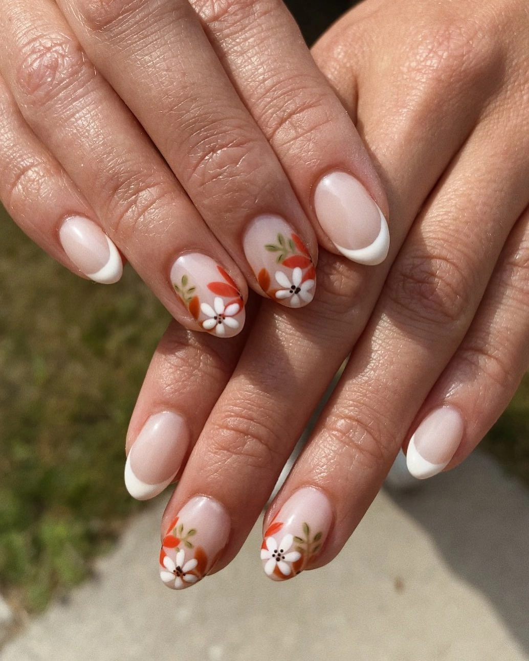 September nail designs 2026 White French Tips With Tiny Autumn Flowers