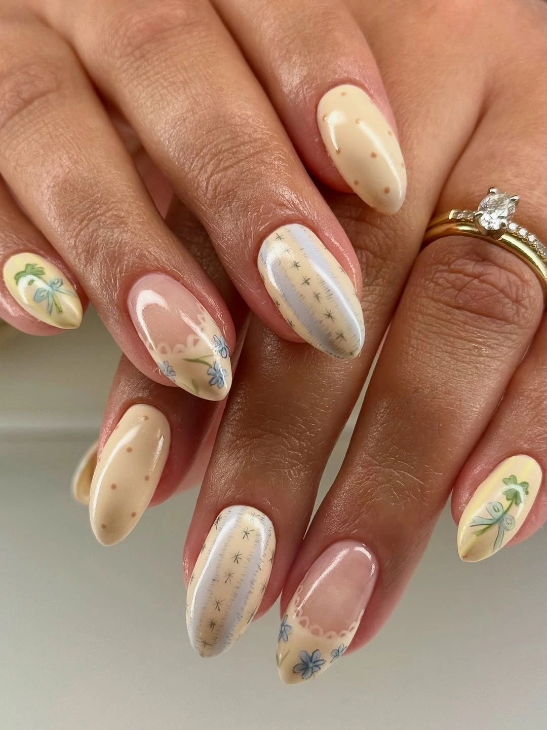 September nails color 2026 Soft Cream Almond Nails With Vintage Floral Details
