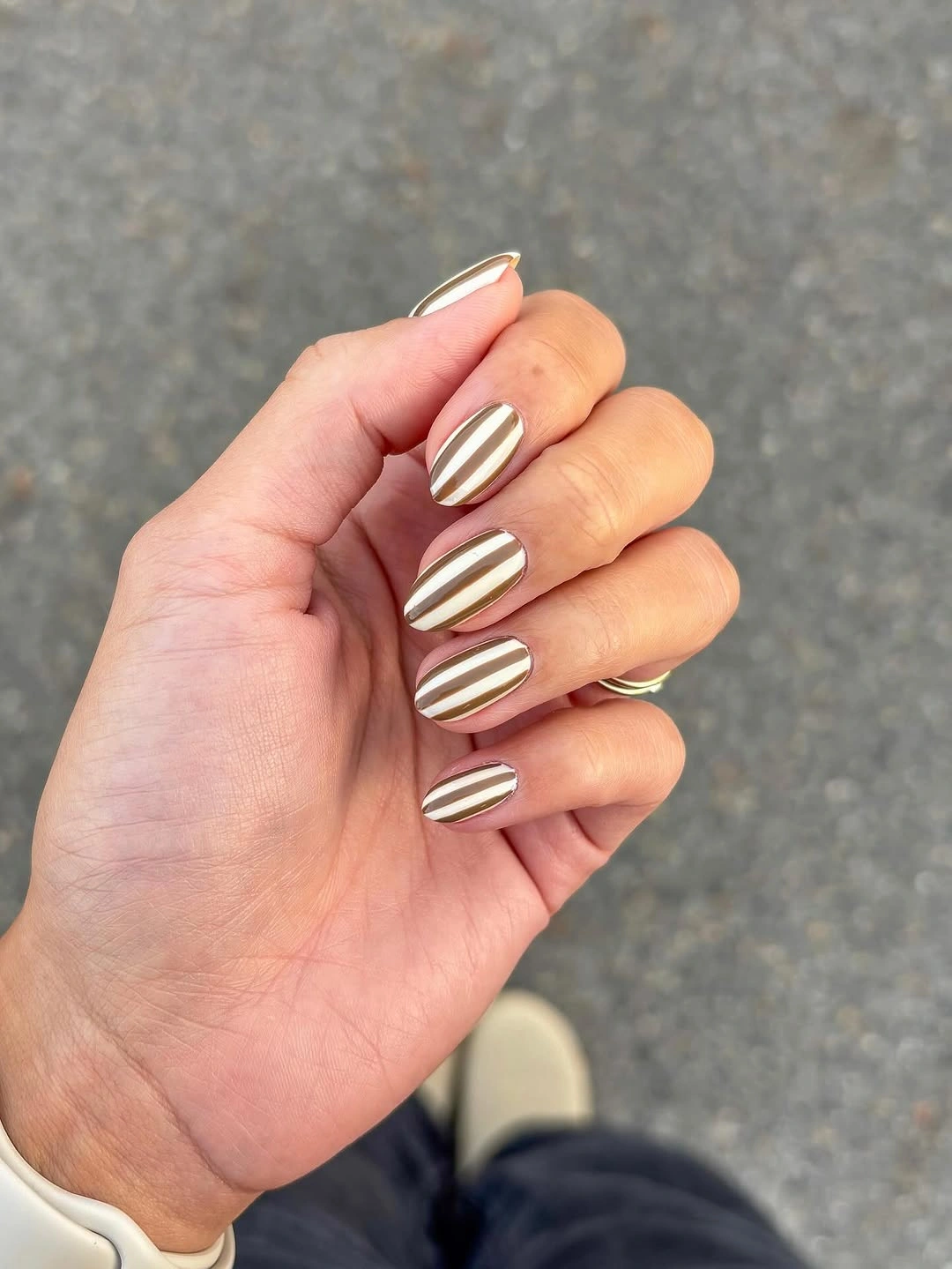 September nails color 2026 Cream Oval Nails With Vertical Gold Stripes