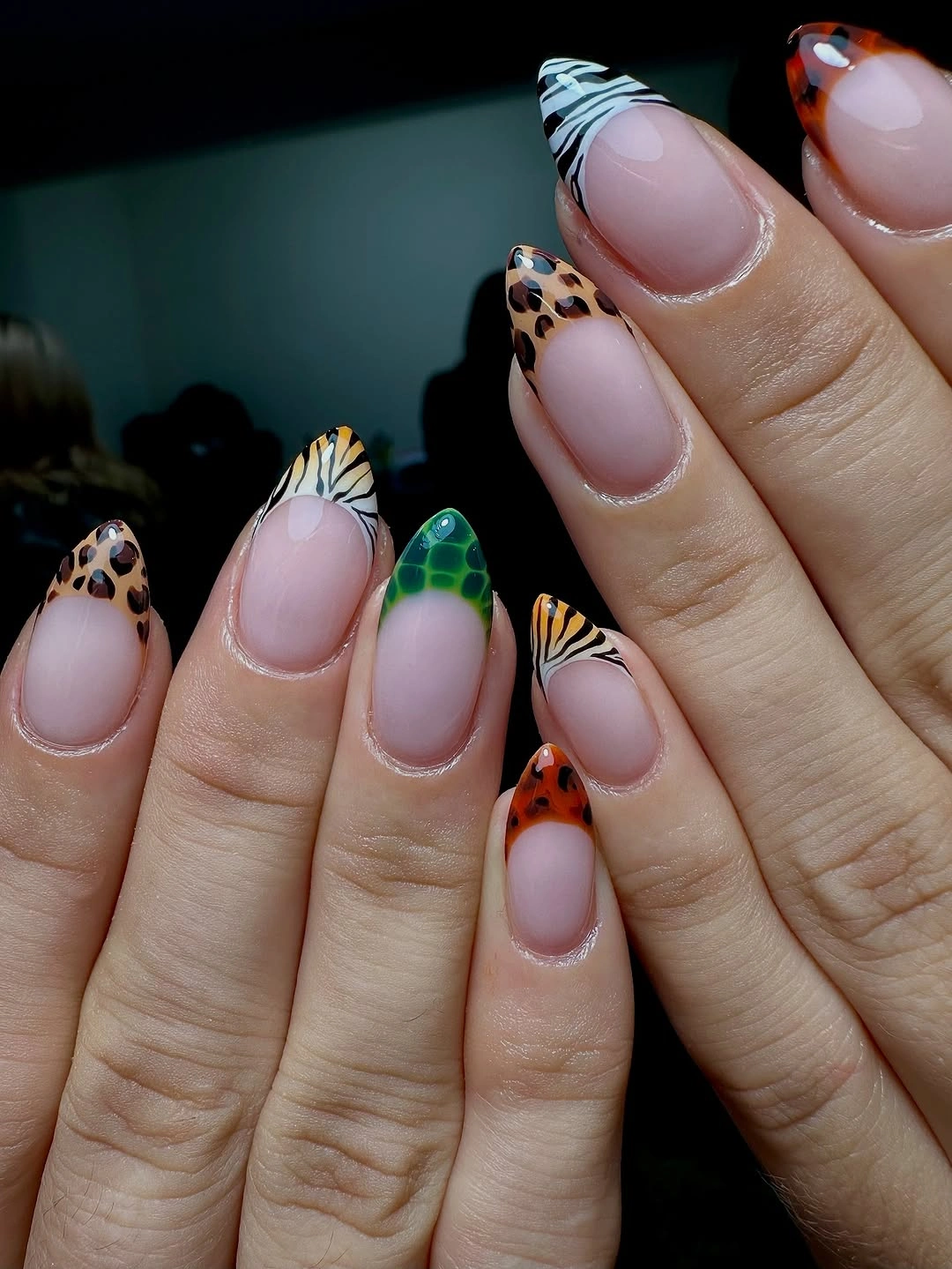 September nails color 2026 Mixed Animal-Print Almond Tips On Nude Bases