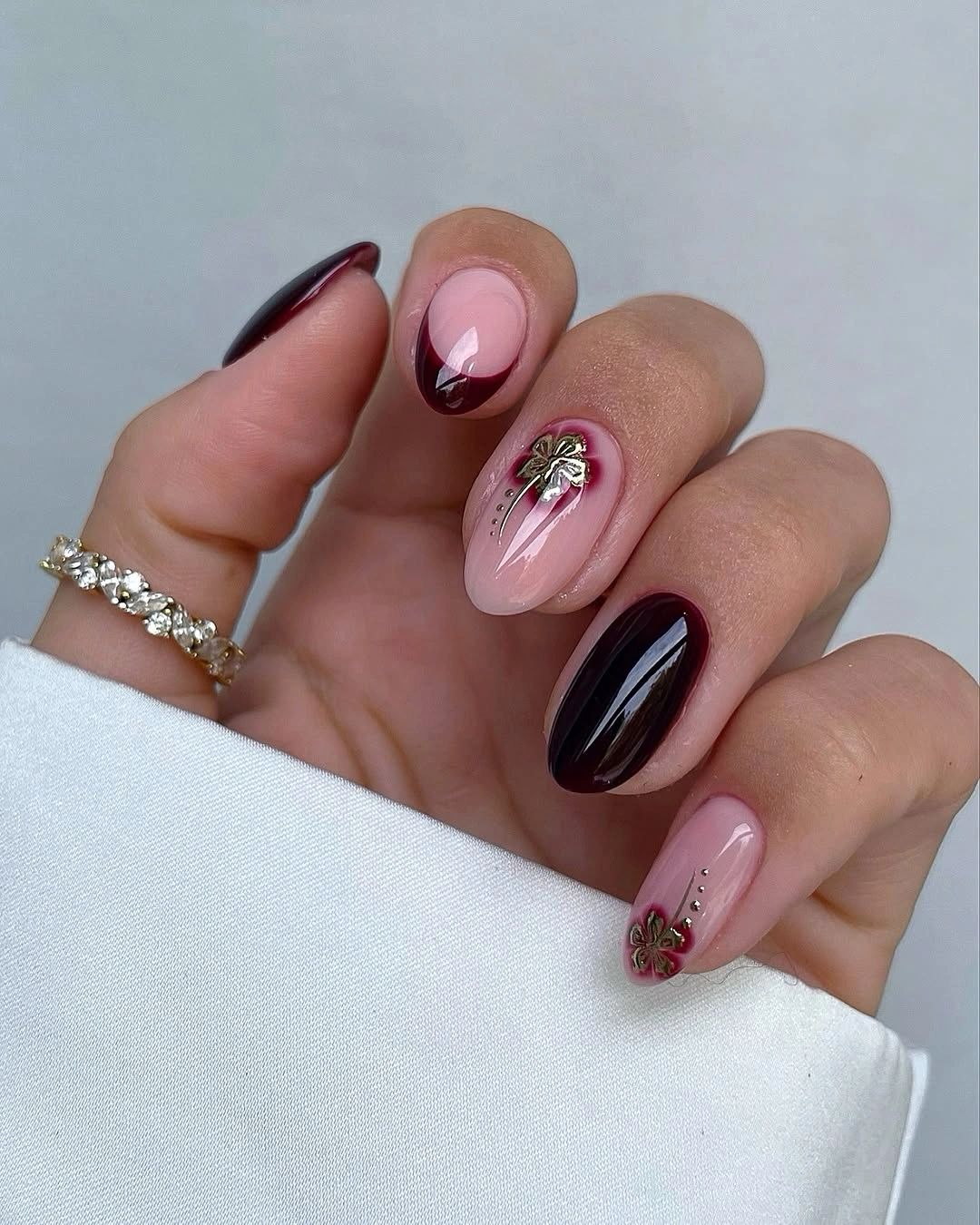 September nails color 2026 Burgundy Almond Nails With Metallic Floral Details
