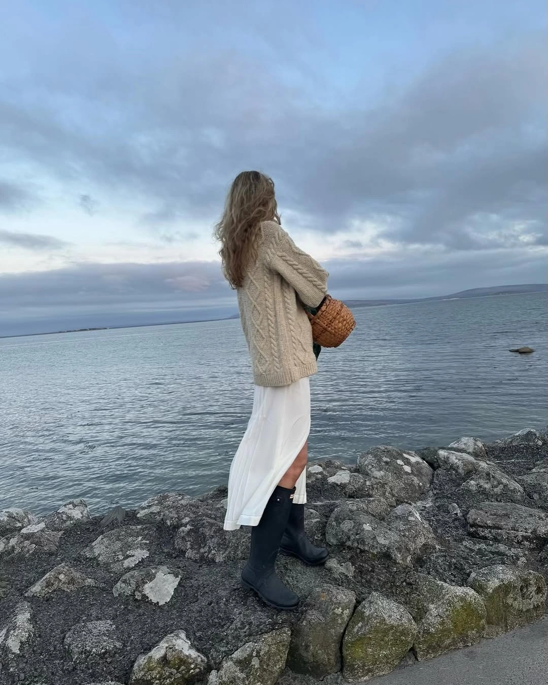 September outfits ideas 2026 Cable Sweater With A White Skirt And Boots
