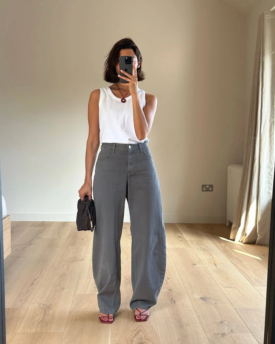 September outfits ideas 2026 Sleeveless White Top With Slouchy Gray Trousers