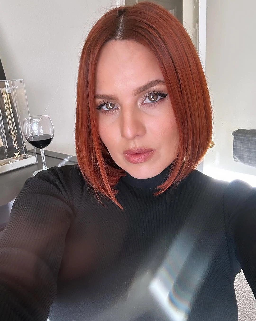 short bobbed hairstyle Polished Copper Bob With a Sleek Center Part