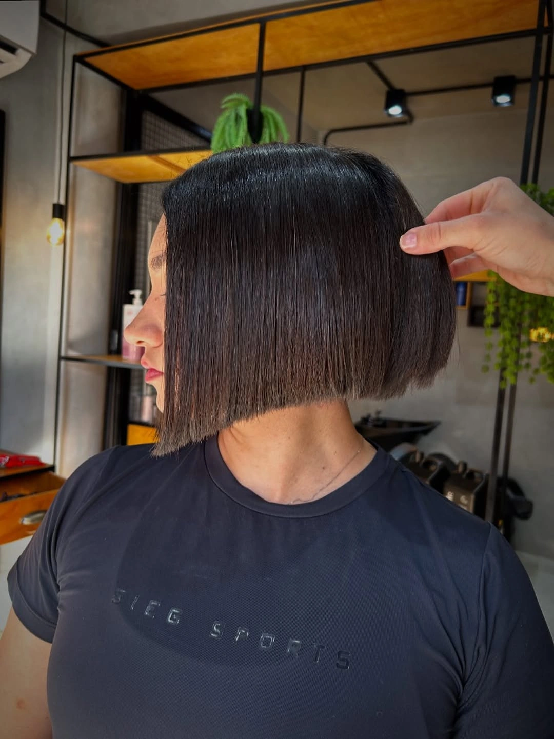 short bobbed hairstyle Ultra Sleek Angled Bob With Mirror Shine